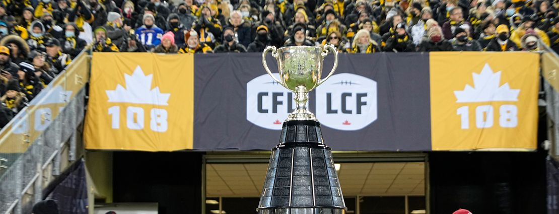 Grey Cup at the Festival Celebration with fans cheering in the background.jpg